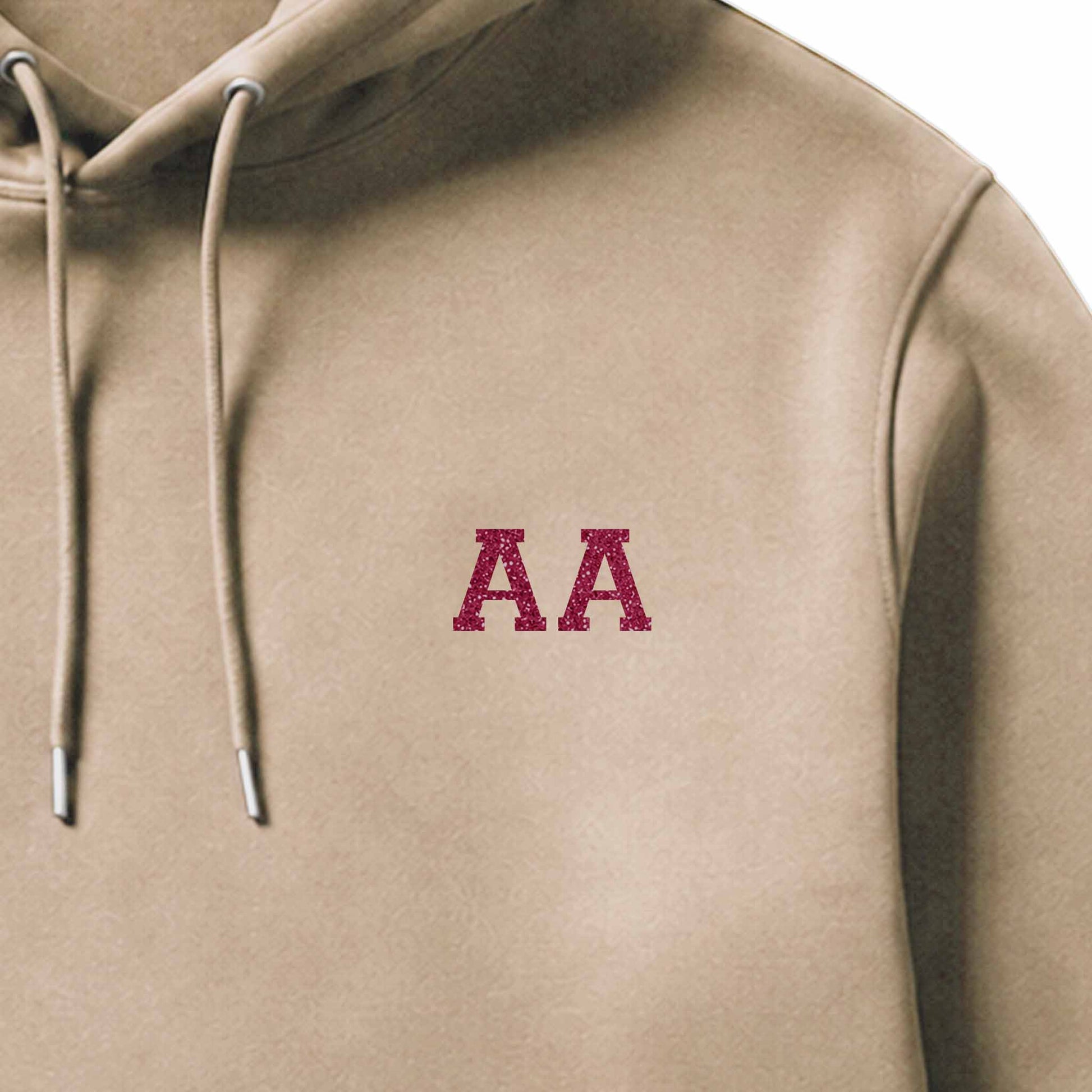 School leavers hoodie with custom iron-on "Initials" design in pink glitter on the front.