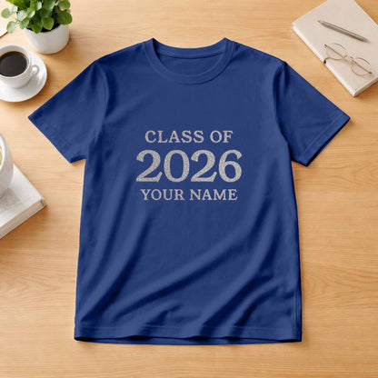 School leavers shirt with custom iron-on "Class of 2026" design in rainbow white glitter on the front.